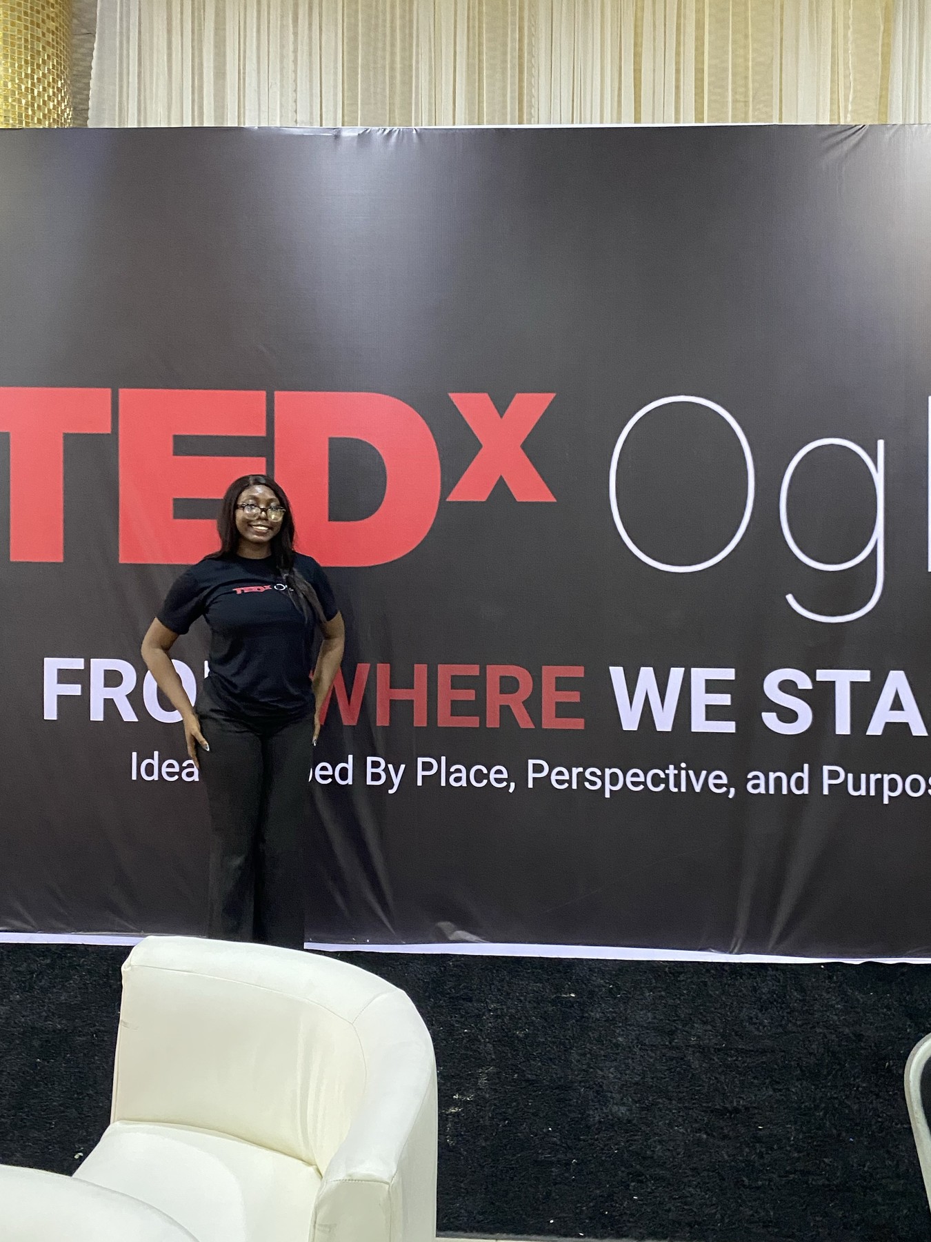 Backstage at TEDxOgba beside the event banner